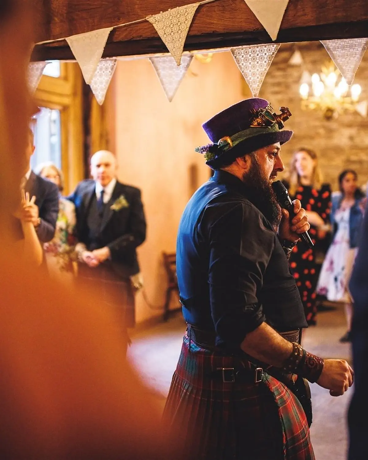 A barn wedding under bunting, Schuggie calling as the floor fills